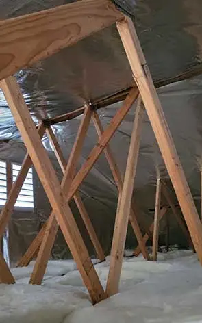 Wooden Rafters in an Attic with Insulation Installation Victorville CA