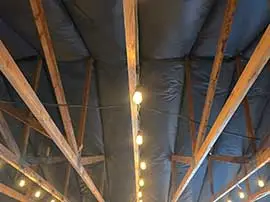 Wooden Beams with Insulation in a Victorville Attic